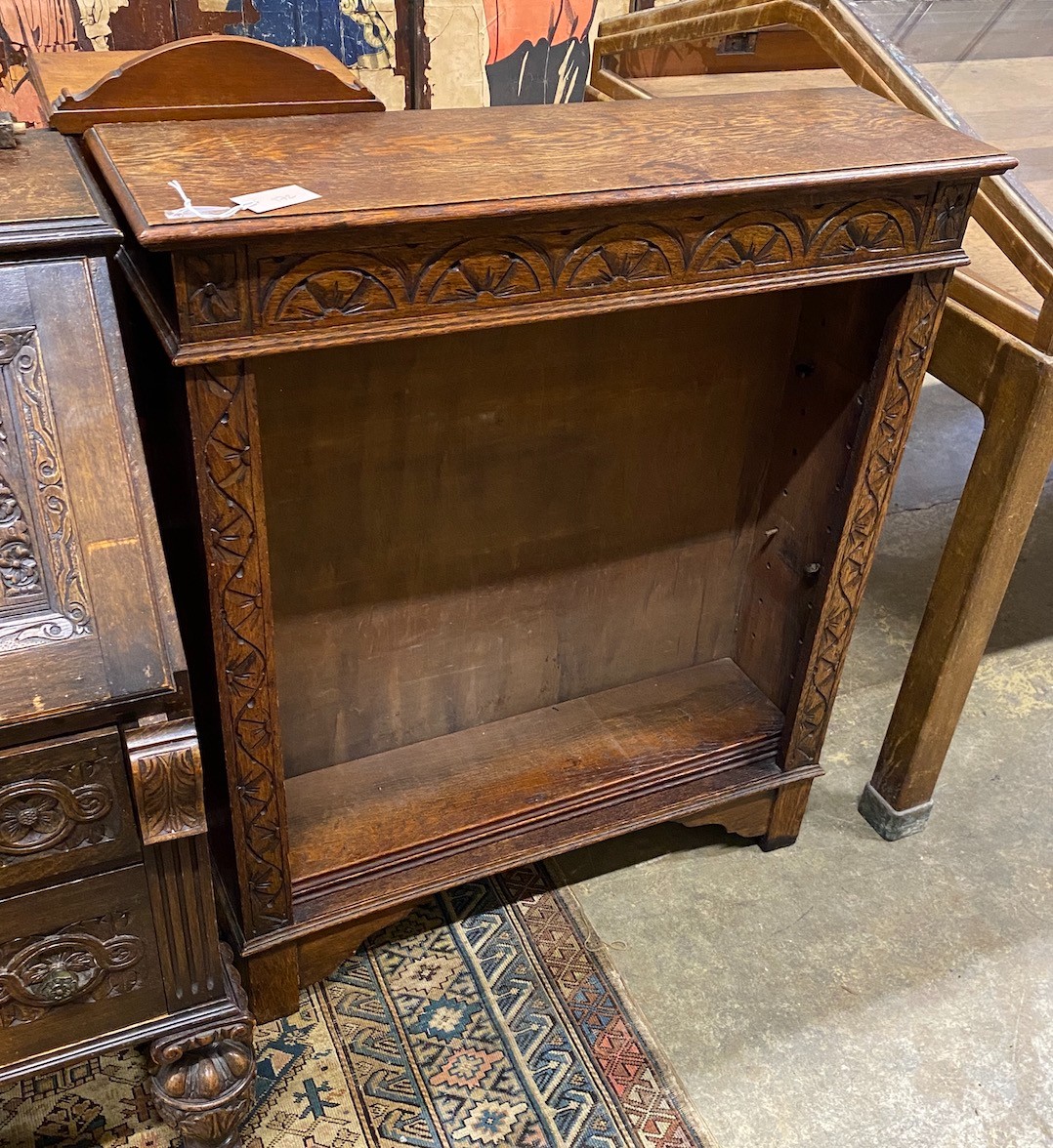 An 18th century style carved oak open bookcase, length 91cm, depth 27cm, height 106cm